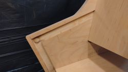 Arcade Cabinet Construction Close-up of a wooden arcade cabinet assembly.