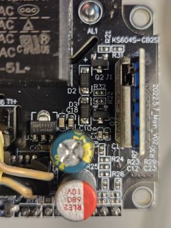 Close-up of a circuit board with visible components, including an AMS1117 regulator.