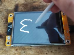 ESP32 Board with TFT Screen and Stylus ESP32-2432S028R board with a large 2.8 TFT touch screen being drawn on with a stylus.