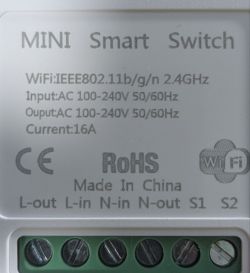 Close-up of a MINI Smart Switch label with technical specs and screw terminal connectors.