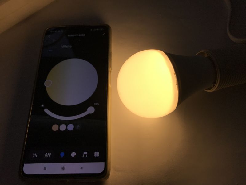 Controlling RGB/CCT LED Bulb with Tuya App LED bulb controlled by the Tuya app on a smartphone.