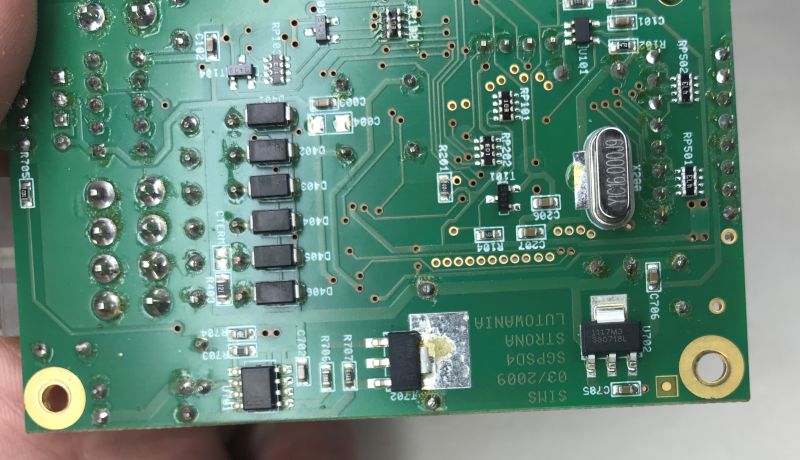 Bottom of the SGPSD4 PCB with visible solder joints, crystal, and SIMS 03/2009 marking.