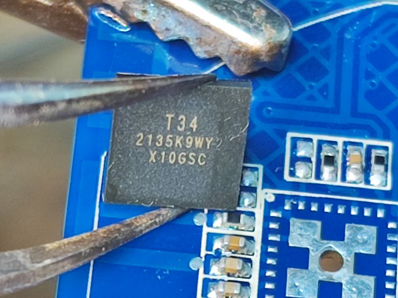 T34 Microchip on Electronic Board Close-up of T34 microchip on a blue electronic board