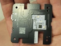 Printed Circuit Board with Electronic Components Printed circuit board held in a hand.
