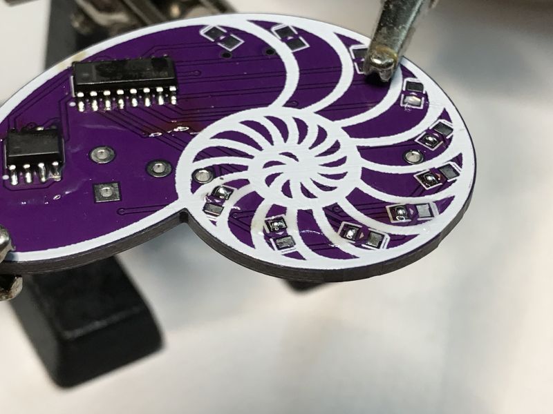 PCB with SMD Components and Spiral Design Purple PCB with SMD components and spiral design.