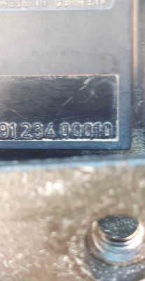 Zbliżenie na numer części samochodowej 9123400010.