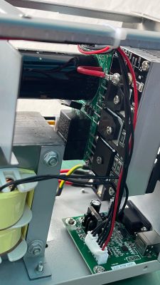 Interior of a Korad power supply with electronic components and wires.