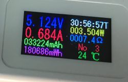 Meter display showing 5.124 V voltage and 0.684 A current from a USB power meter