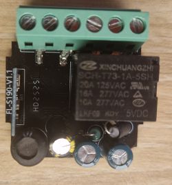Relay module with terminal block and electronic components on a black PCB