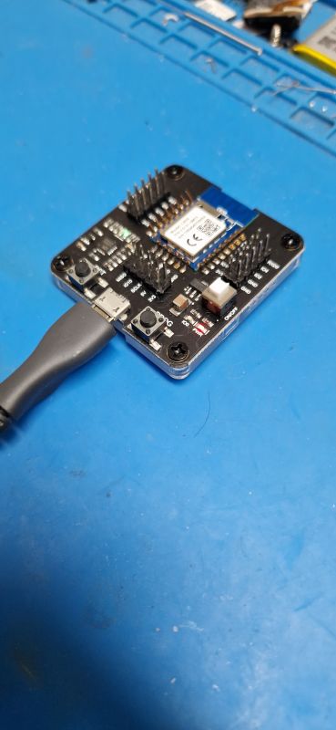 USB to UART Development Board with ESP Module Development board with an inserted ESP module, connected to a USB cable.