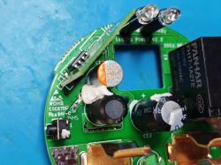 Sonoff S60TPG PCB with relocated ESP32-C3 module Close-up of the Sonoff S60TPG smart plug PCB with visible electronic components, capacitors, and a relay.