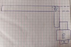 Rysunek techniczny przedstawiający schemat zamka drzwiowego na papierze w kratkę.