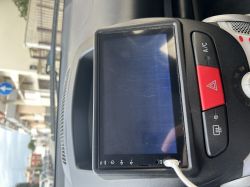 Car radio screen with visible horizontal lines.