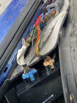 Soldered Wires in Car Car wiring harness with visible soldered connections.