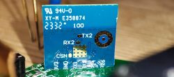 Close-up of a circuit board with a blue module labeled XY-M E358874 and markings TX2, RX2, and CSN.