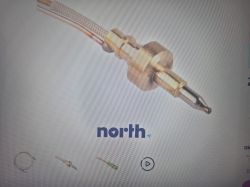 Zbliżenie na metalowy czujnik/termoparę z przewodem na stronie z logo „north”.
