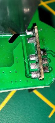Close-up of PCB Components Close-up of a PCB with electronic components and soldered connections.