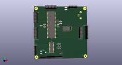 Widok projektu płytki PCB z elementami elektronicznymi na ciemnozielonym tle.