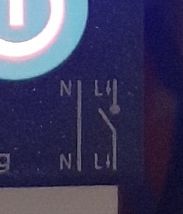 Close-up of the front panel of an electrical switch with N and L markings.