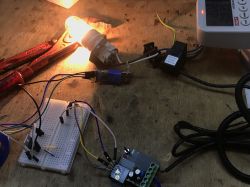 Test setup with a current meter and a lit bulb