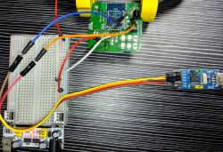 Programming setup with a breadboard, BK7231T microcontroller, and UART adapter.