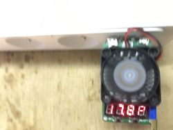 Small fan on a PCB module with a red LED display and connected wires