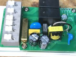 Interior of WS-05H1 Module with Relays and Power Supply Close-up of the WS-05H1 module's interior showing relays, capacitors, and a flyback power supply.