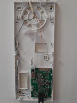 Intercom Wiring Issue Door intercom with open casing and visible wiring.
