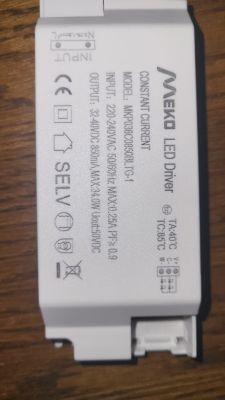 Meko MKP060C1450BLTG-1 LED driver module on a wooden surface.