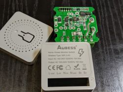 Interior and casing of Aubess power monitor switch with a circuit board.