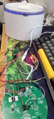 Electronic setup with visible circuit board on a desk.
