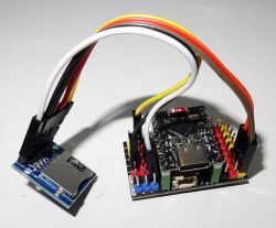ESP32-C3 Module with MicroSD Card Adapter ESP32-C3 module connected to a microSD card adapter using cables.