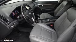 Interior of a Hyundai car showing the steering wheel, dashboard, and seats.