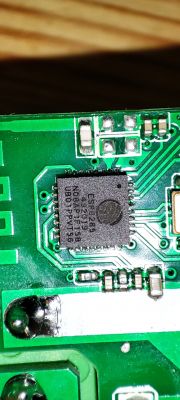 Close-up of a circuit board with an ESP8285 chip.