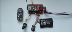 Prototype device with an ESP module, wiring, and a display showing internet radio playback information.