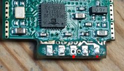 Close-up of a printed circuit board with an integrated circuit and other electronic components.
