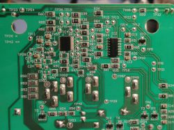 Close-up of a printed circuit board with electronic component labels.