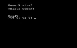Ekran startowy komputera z napisem „Memory size? *Basic COBRA* Ready” oraz wpisanymi wartościami „60 61 62 63”.