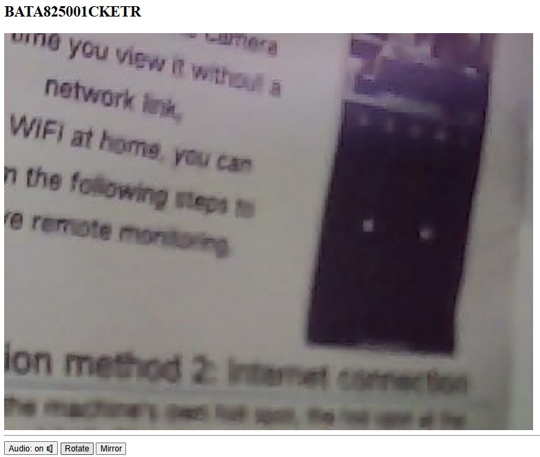 Blurry manual with text and a photo of a device A blurry photo of a manual page with visible English text and an unclear image of an electronic device.