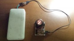 USB-Powered Nixie Tube Tester Nixie tube tester connected to a power bank via USB.