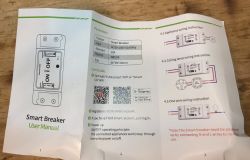 Smart Breaker user manual on a table.