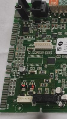 Image of a green PCB with various electronic components.
