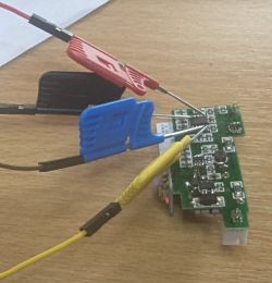 Printed circuit board with attached test probes.