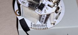 Inside of a Disassembled Smart Plug Inside of a disassembled smart plug showing a circuit board.