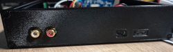 Rear panel of a black, printed case with antenna sockets and USB ports.