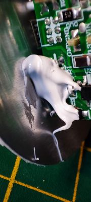 Close-up of PCB Covered with Silicone Close-up of a PCB with white silicone.