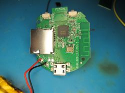 Printed Circuit Board with Micro USB and Memory Card Slot Printed circuit board with electronic components, a micro USB port, memory card slot, and power wires.