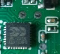 Close-up of a circuit board with an integrated circuit and traces.