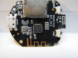Round Printed Circuit Board with Micro USB Port Close-up view of a round printed circuit board with a micro USB port, electronic components, and conductive traces.