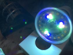 Close-up of a colorful LED diode with bright light spots.